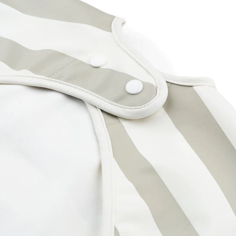 Babero con bolsillo y mangas con rayas Done by Deer